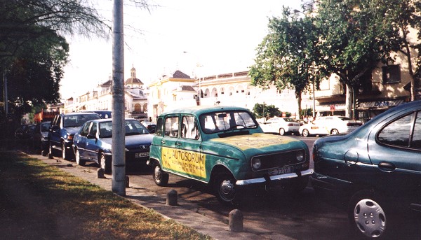 A green Renault 4 parked on one of the main streets in Seville